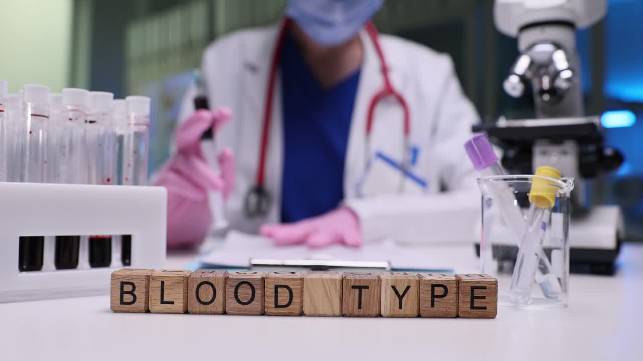 Medical professional conducting blood type analysis in a laboratory