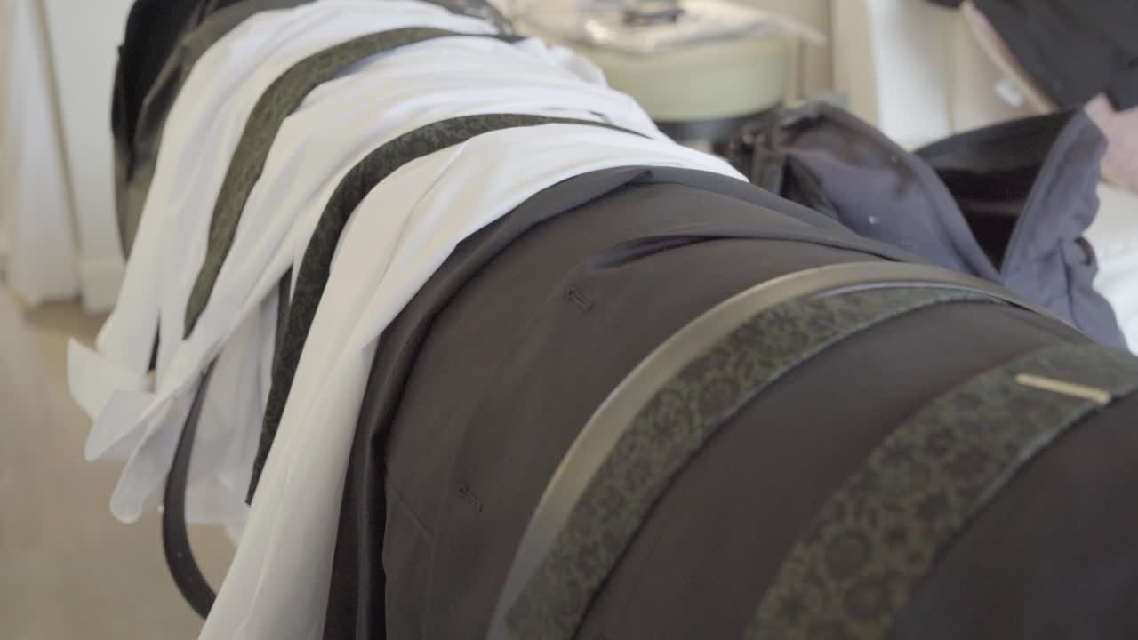 sliding shot of groom and groomsmen wedding day shirts and ties