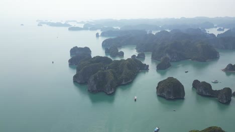 epic drone shot over group of islands in cat ba and halong bay in northern vietnam