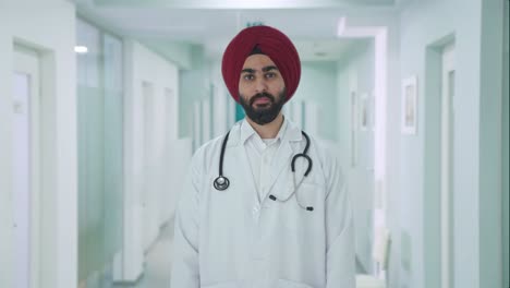 serious sikh indian doctor looking