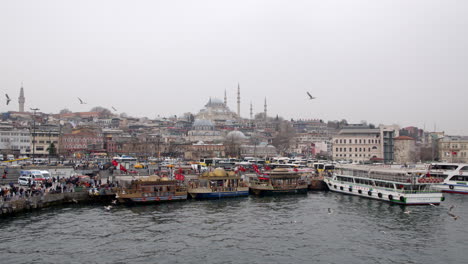 golden horn view in istanbul next to galata bridge with old mosque