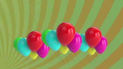 animation of colourful balloons over green background