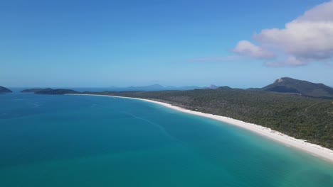 pristine beach with turquoise-hued water and white silica sand