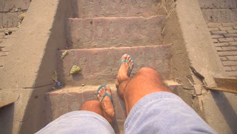 POV-Shot-of-Feet-Walking-Down-Some-Steps