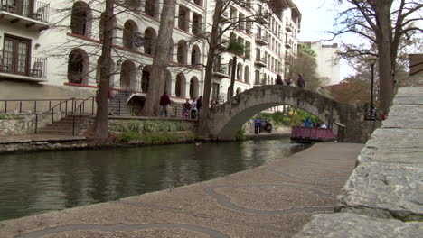 this is a side angle shot of the river walk in san antonio