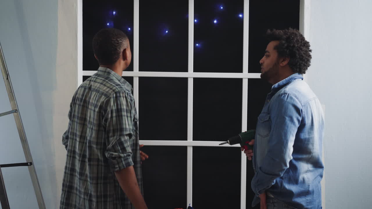 African-American builders talk and look at constellations