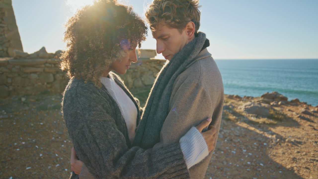Closeup affectionate couple bonding posing camera on sea beach. Romantic date