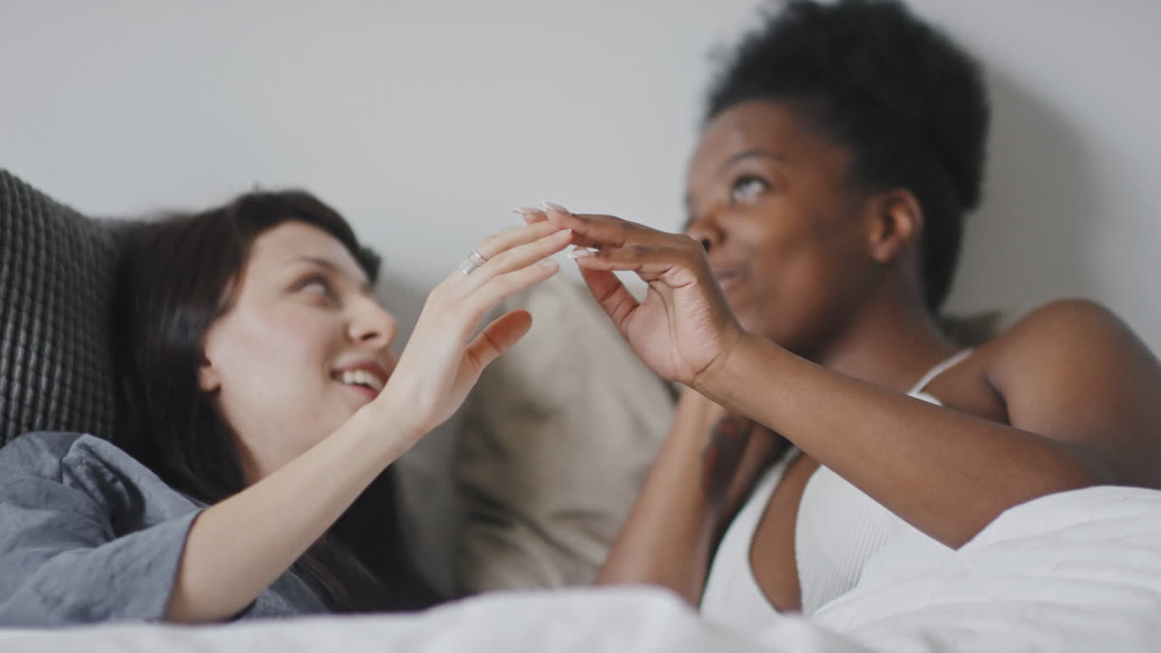 Happy Lesbian Couple in Bed