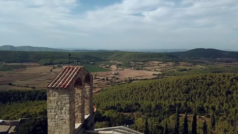 Aerial-view-of-the-castle-ruins-and-church-of-Vilademager-in-Catalonia,-Spain,-Europe