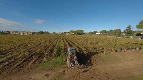 vineyard tractor at work in baillargues, france