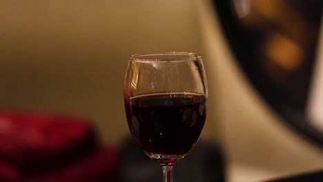 a wine glass in a cozy setting