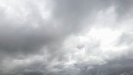 Mid-afternoon-thunderstorm-rain-clouds-forming-and-blending-across-the-african-horizon-time-lapse,-noise-free-4k-footage