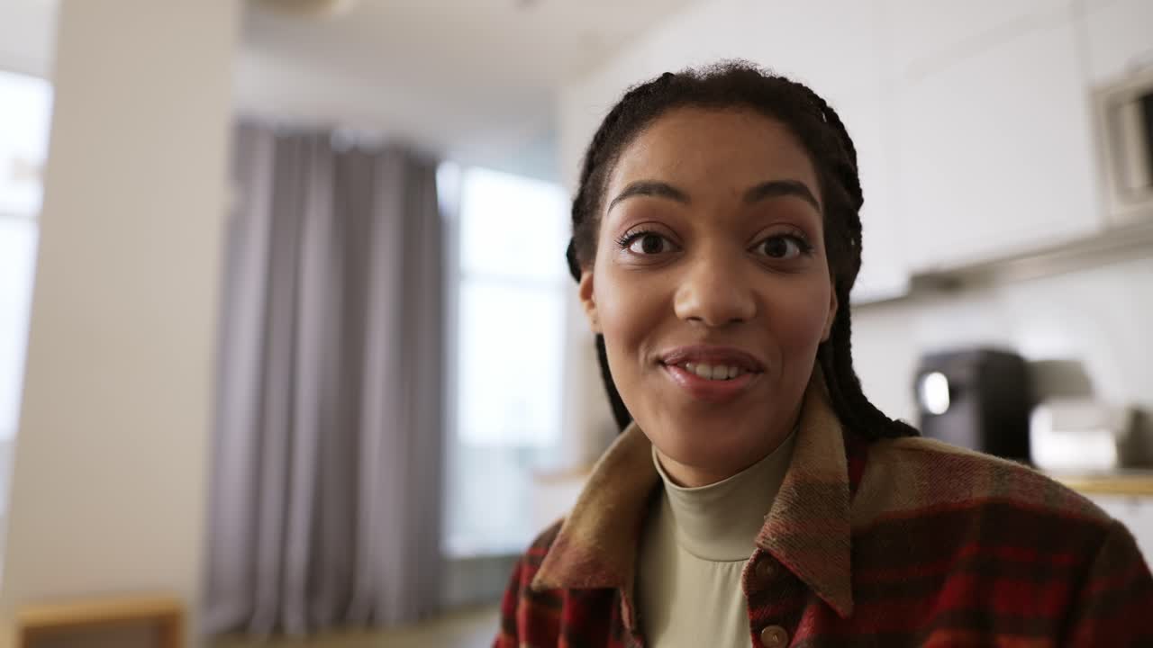 Happy biracial female talking to camera