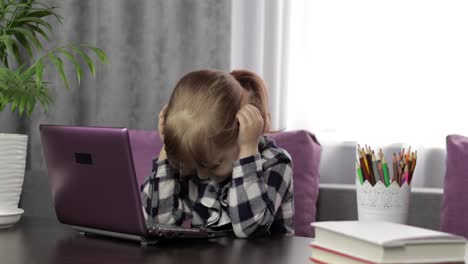 Girl-studying-online-homework-using-digital-laptop-computer.-Distance-education