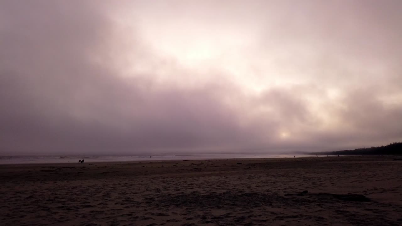 Serene Sunset Beach with Fog