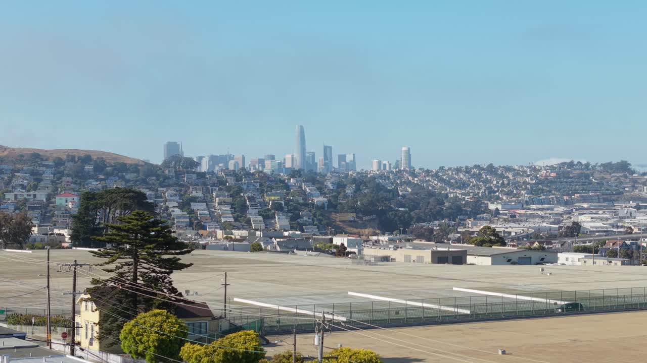 From above, Bernal Heights rises gently, dotted with charming homes and walking paths.