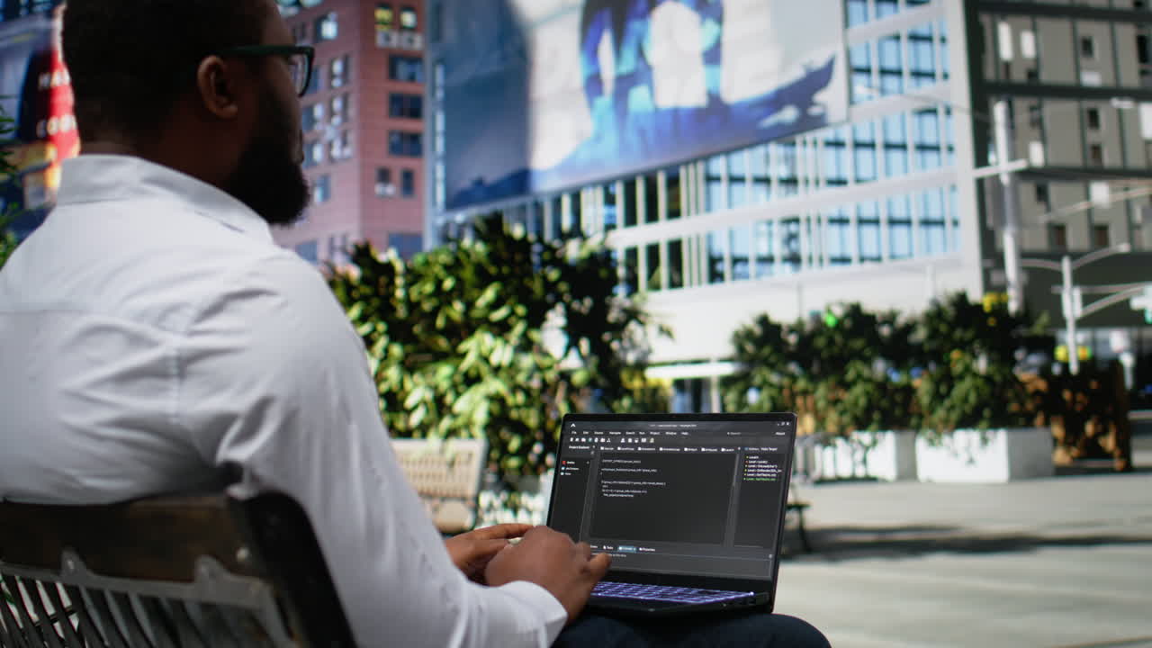 Confident adult reviews binary code script for his programming remote work