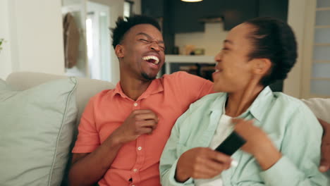 Excited-black-couple-watch-television