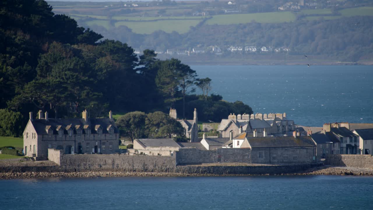 Mid shot of buildings on St Michael's mount taken from the village of Marazion