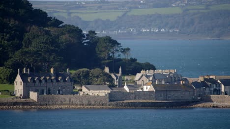 mid shot of buildings on st michael's mount taken from the village of marazion