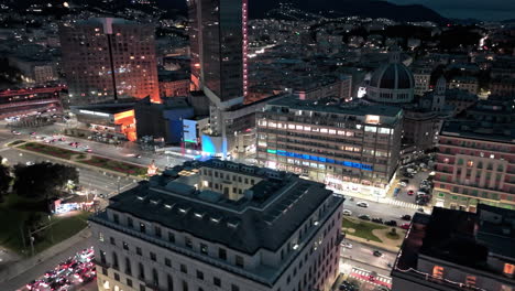 night drone view of traffic flow on viale brigate partigiane in genoa italy