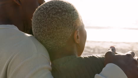 young couple hug and watch the sunset