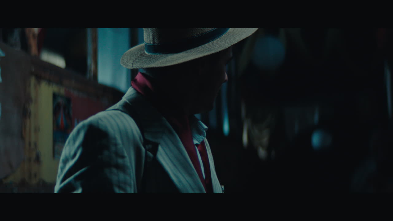 A man witch mustache in the empty gypsy circus camp at night