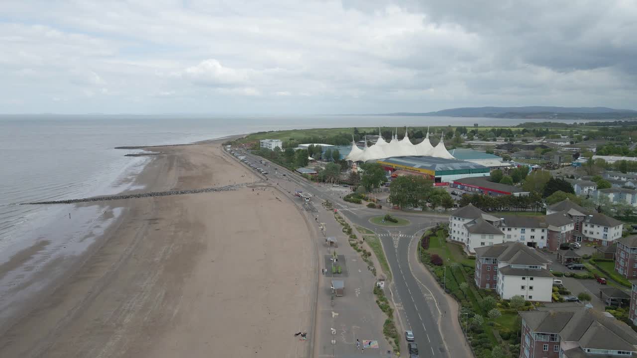 Aerial view of Minehead a beautiful historic seaside town on the edge of Exmoor In West Somerset. Drone moving forward over the beach in direction to to the Bristol Channel