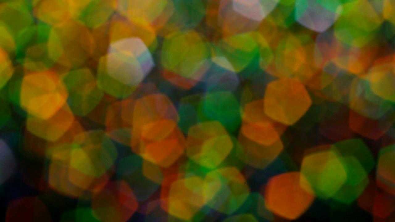 Abstrakte, mehrfarbige, verschwommene Glitzerlichter und Funkeln