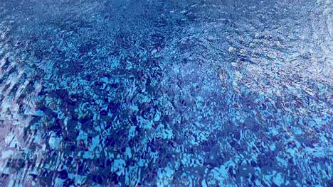 Strong-gusts-of-winds-blow-over-the-surface-of-the-pool-water-and-create-a-mesmerizing-pattern-in-a-rhythmic-motion