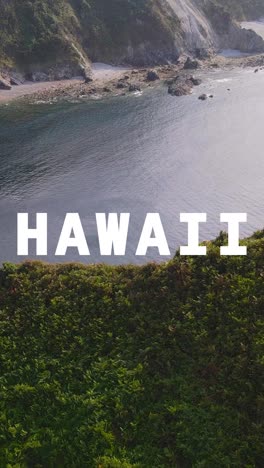 Vertical-Video-Drone-Shot-Of-Island-Coastline-With-Ocean-Overlaid-With-Animated-Graphic-Spelling-Out-Hawaii