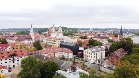 Colorful-rooftops-of-Kaunas-city,-aerial-side-flying-view