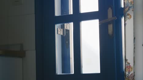 panning up view of kitchen door in santorini, greece