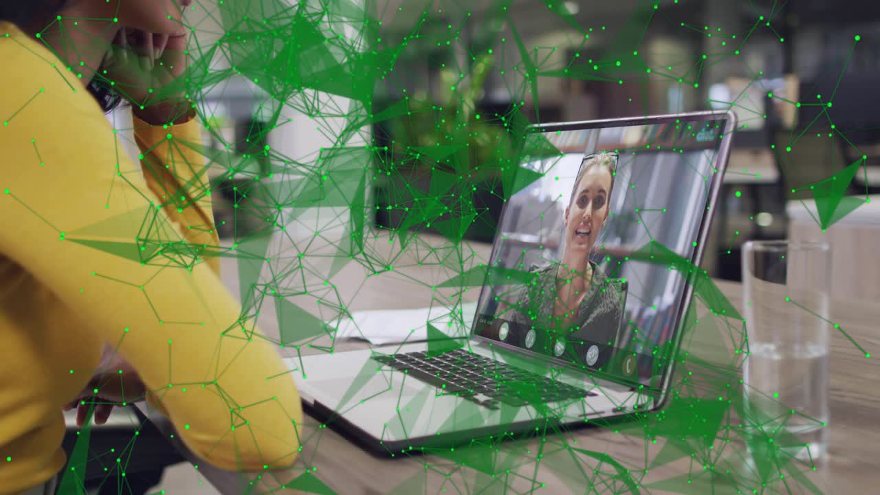 Seated woman leaning left listening to caller speaking on laptop business call green net sweeping