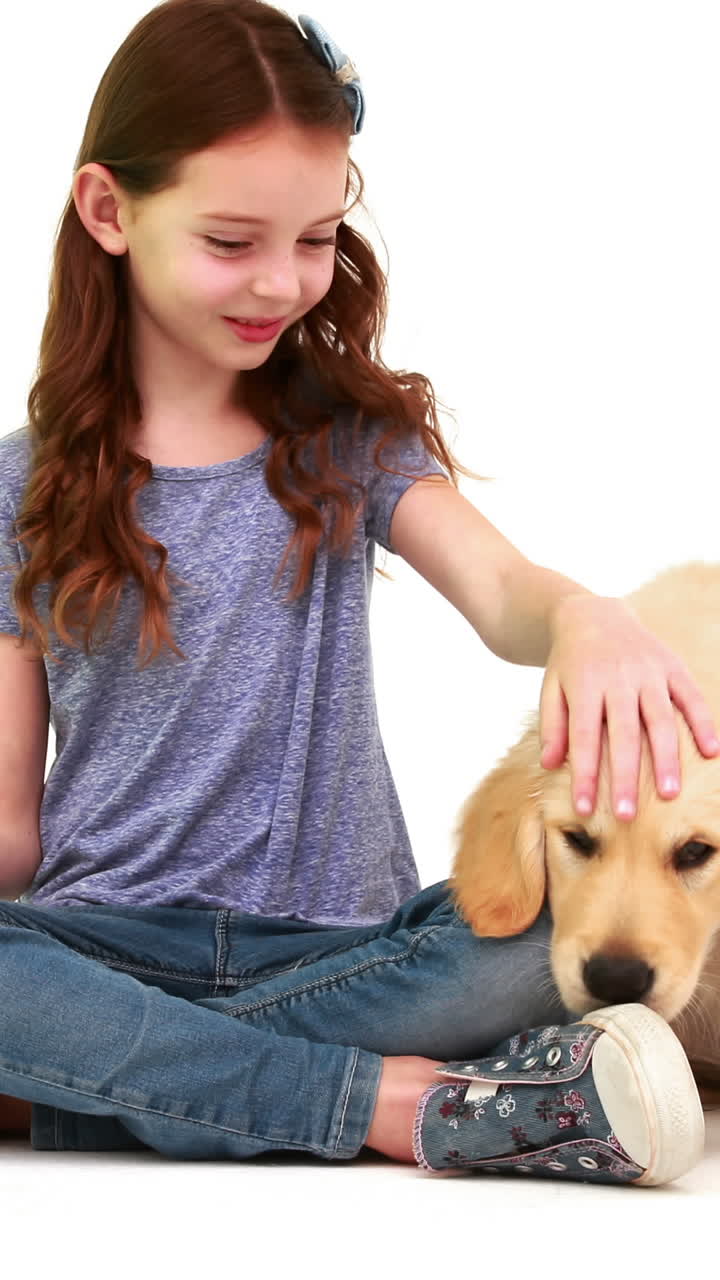 Smiling girl with cute puppy