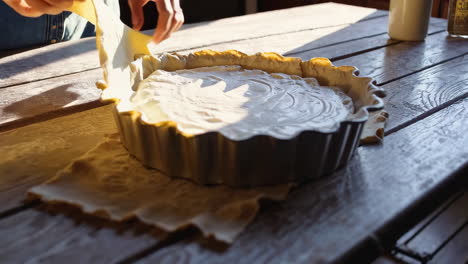 hands preparing a pie or tart