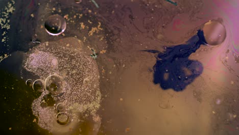 abstract golden bubbles and dark liquid background texture