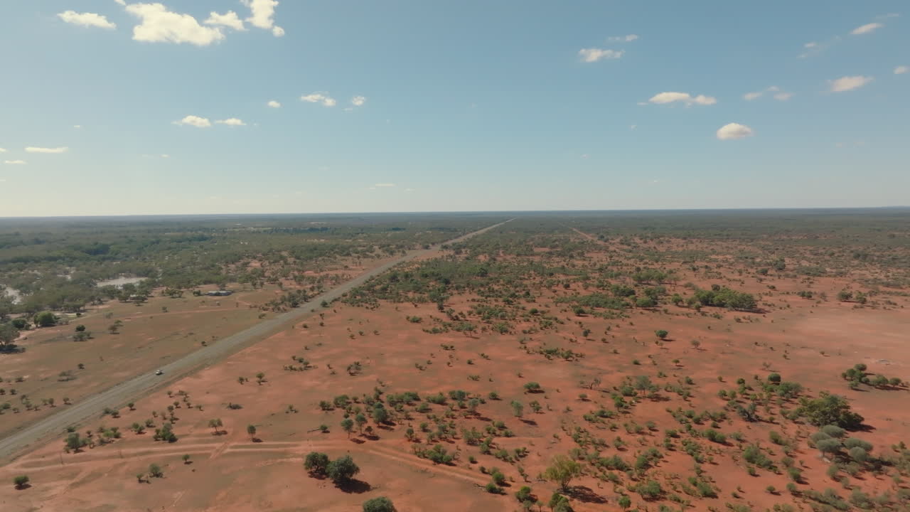 Aerial: Drone shot flying next to Louth road in outback New South Wales, Australia