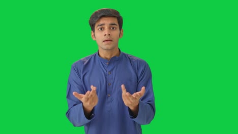 leftist indian man asking questions green screen