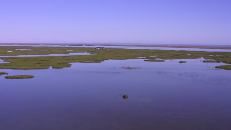 droning towards the lydia ann lighthouse over south bay in aransas pass texas