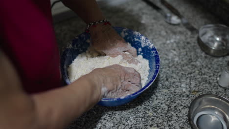 milk and cassava starch shown beside butter and cheese for authentic mbeyu preparation, hands mixing ingredients in bowl