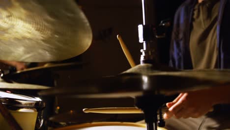 drummer playing drum in studio