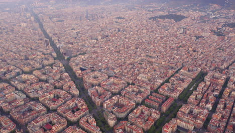 aerial view of square blocks in new quarter of barcelona at sunrise, diagonal avenue, spain