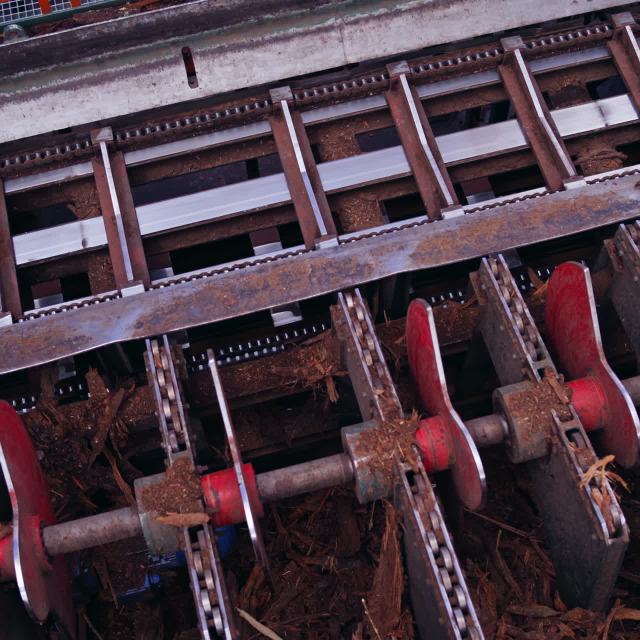 Sawmill. Process of removing bark from logs. Special machinery with conveyor. heavy technic at plant, Timber industry. View from the top.