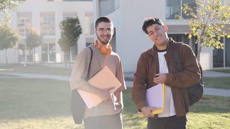 two students looking at the camera standing in the campus