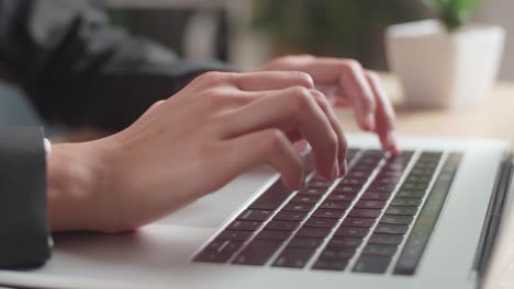 person typing on laptop