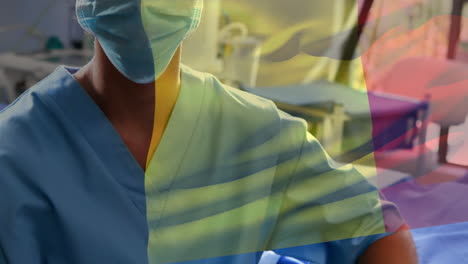 animación de la bandera de francia sobre una doctora biracial con máscara facial