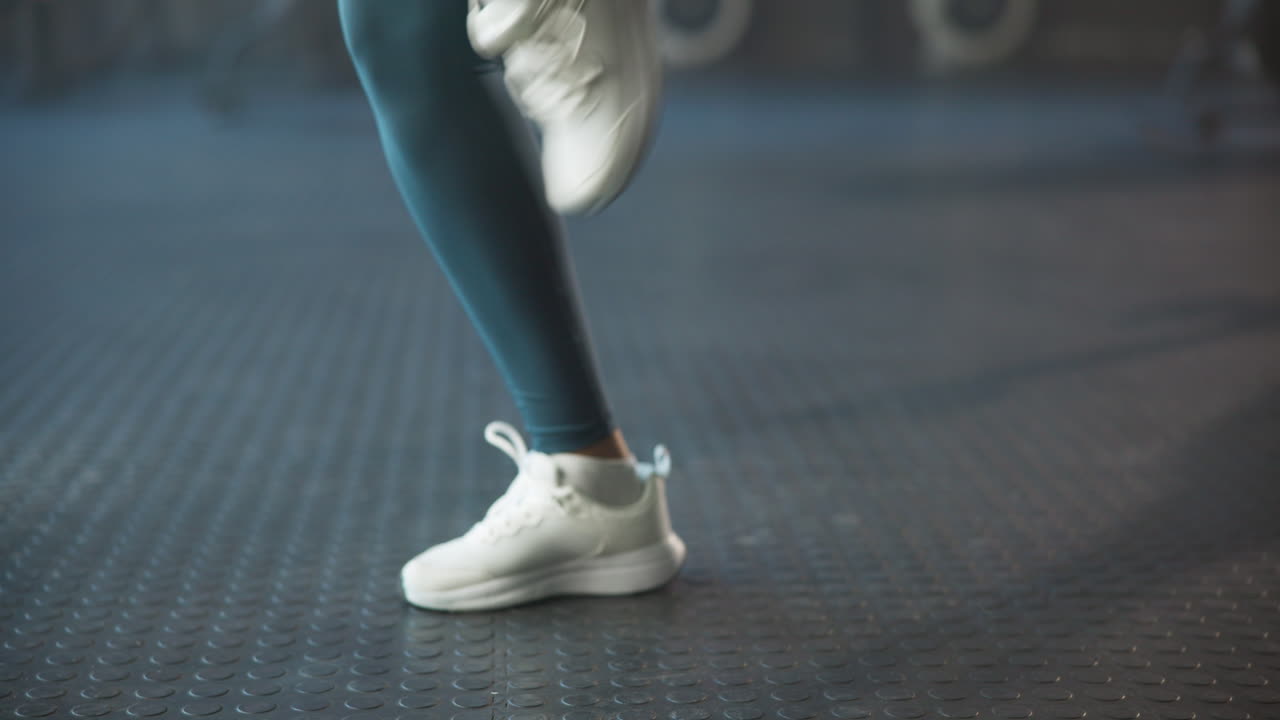 Close-up of Legs in Sneakers Running