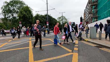 crowds crossing road during edinburgh fringe festival