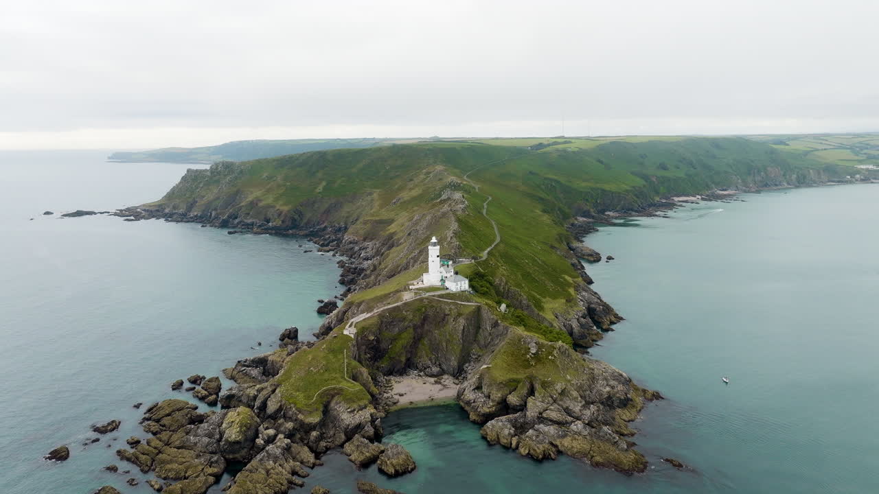 Aerial view of a lighthouse on a coastal cliff